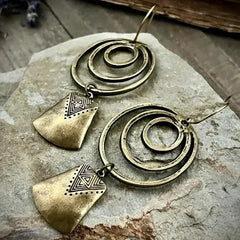 Bohemian Style Silver Alloy Earrings With A Sculpted Design