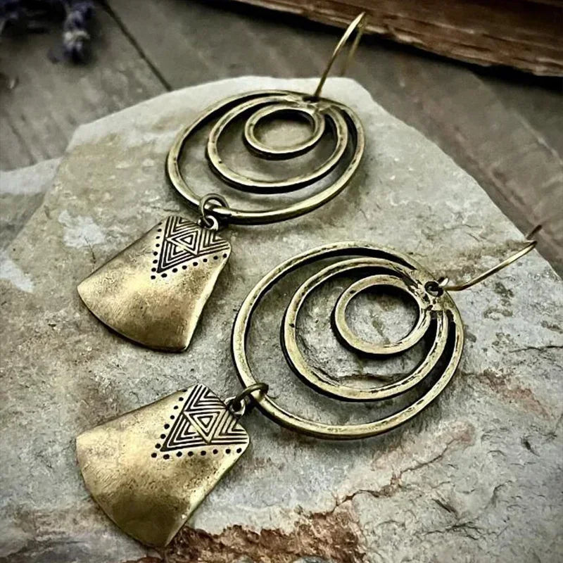 Bohemian Style Silver Alloy Earrings With A Sculpted Design