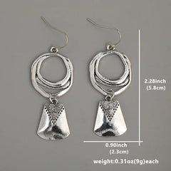 Bohemian Style Silver Alloy Earrings With A Sculpted Design