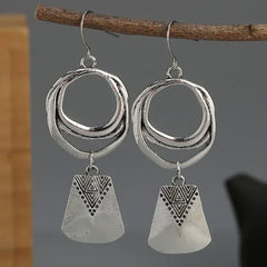 Bohemian Style Silver Alloy Earrings With A Sculpted Design